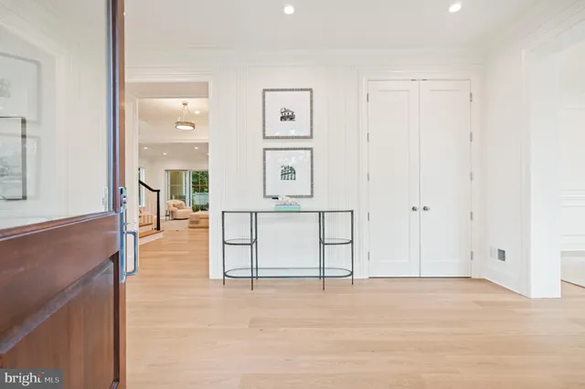 a living room with furniture a fireplace and a large window