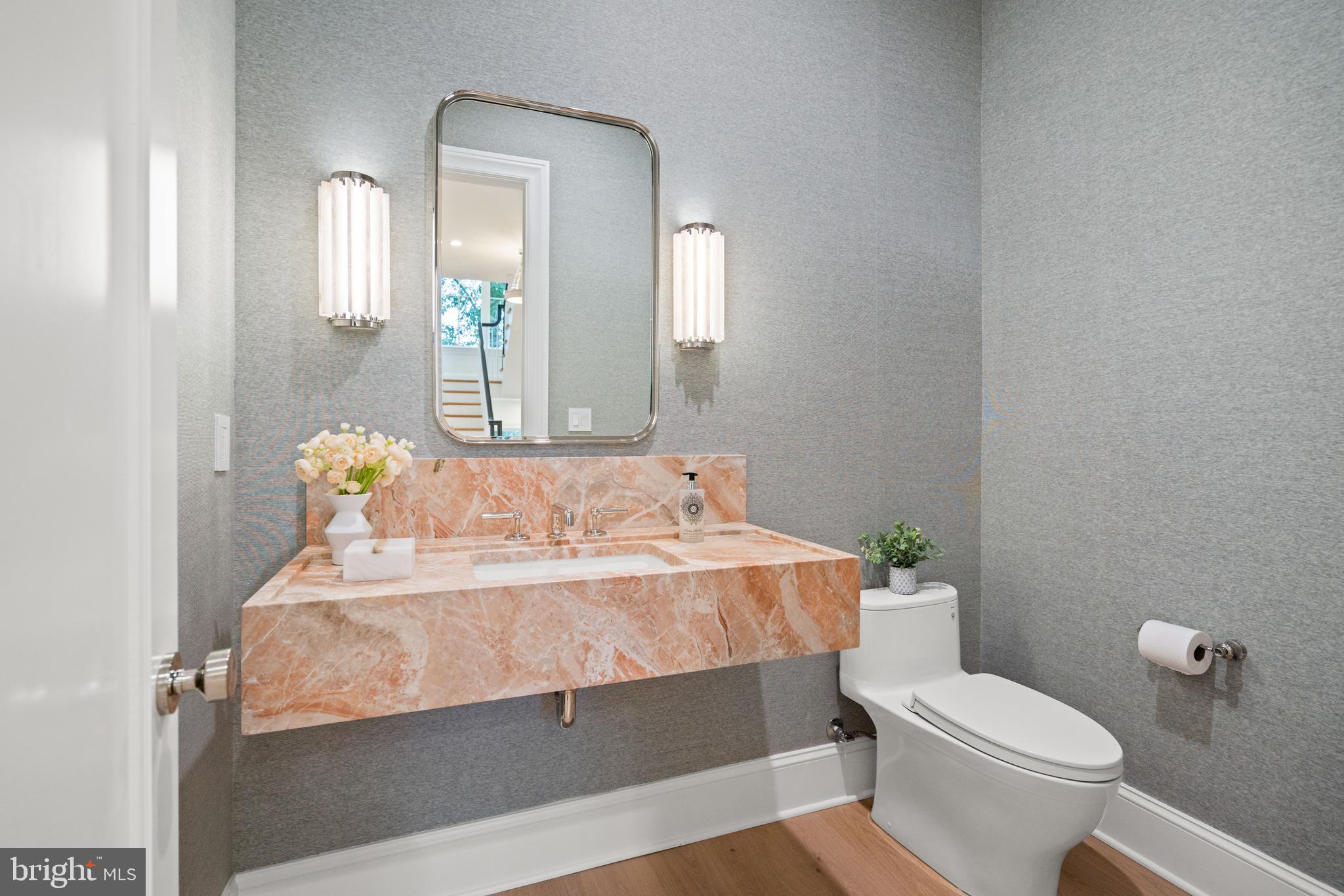 2916 Chesapeake Street Northwest Washington, DC 20008 - Photo 23 of 62 a bathroom with a sink toilet and mirror