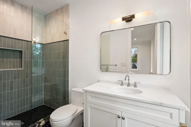 a utility room with cabinets washer and dryer