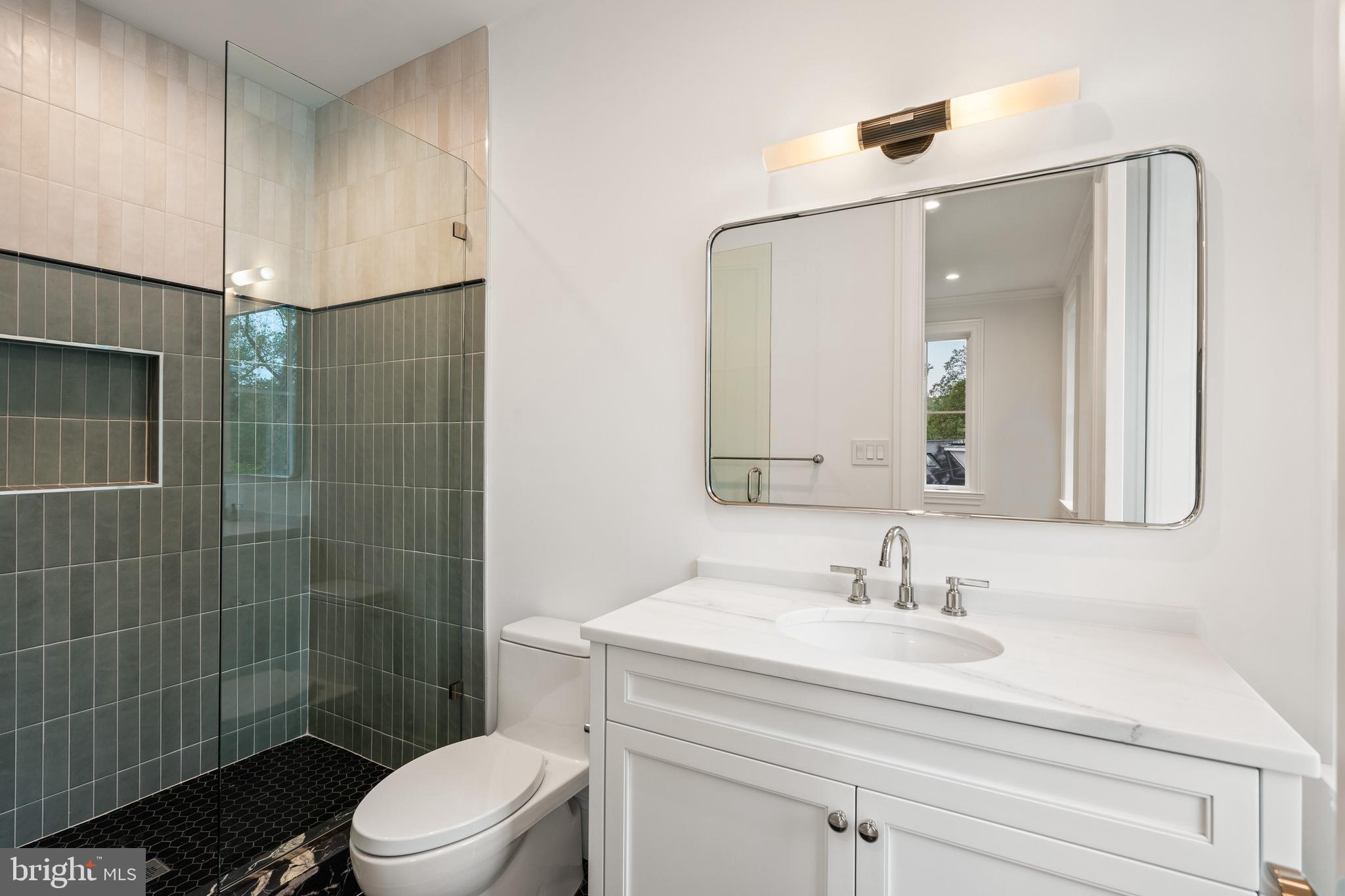 2916 Chesapeake Street Northwest Washington, DC 20008 - Photo 29 of 54 a bathroom with a sink toilet and shower