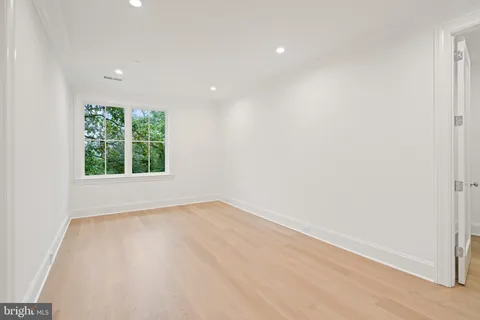 a view of balcony with wooden floor