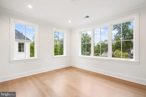 a living room with furniture staircase and a potted plant