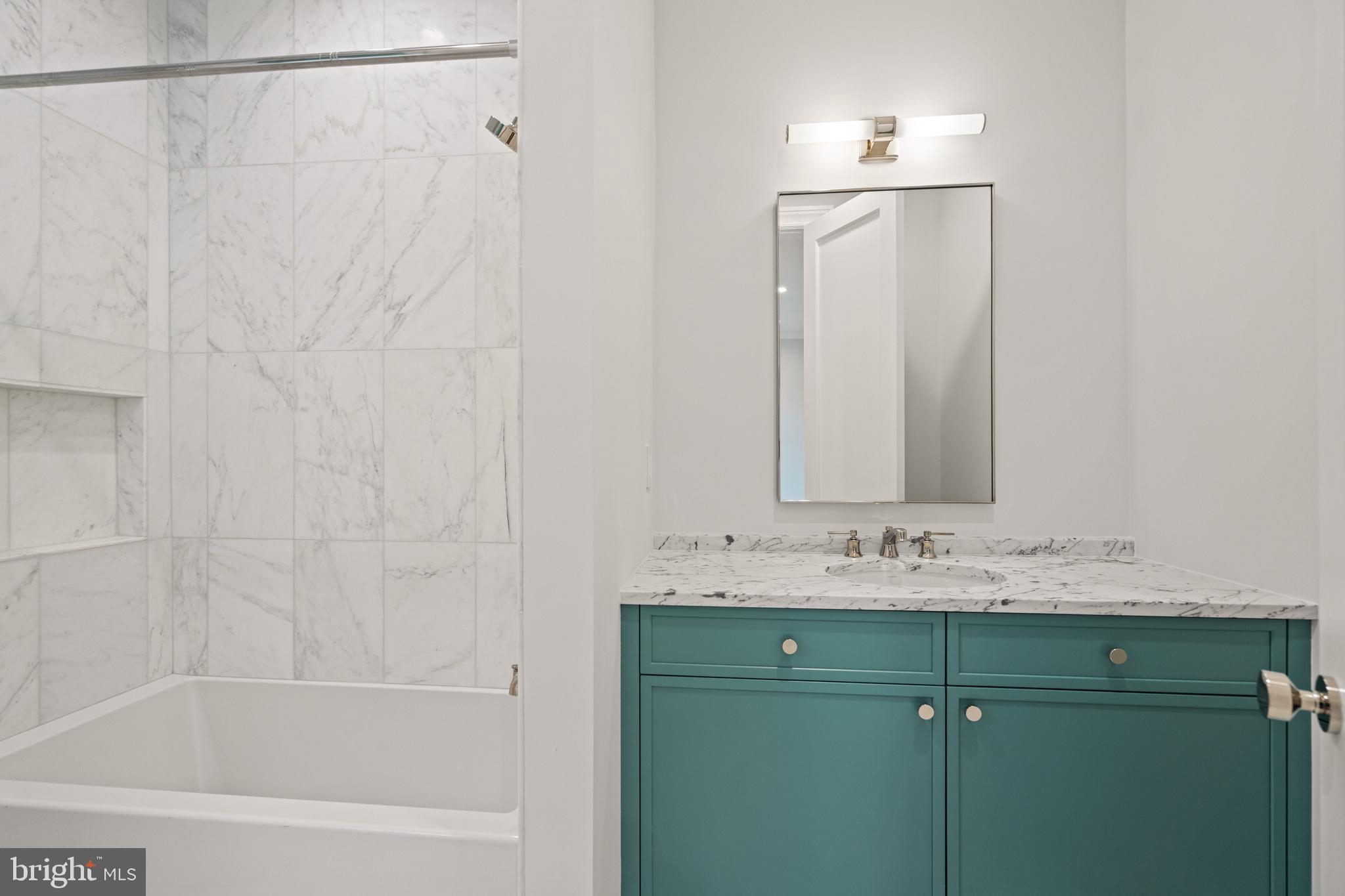 2916 Chesapeake Street Northwest Washington, DC 20008 - Photo 37 of 62 a bathroom with a sink and a mirror