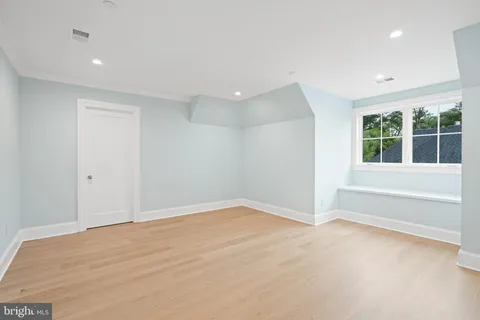 a living room with furniture staircase and a potted plant