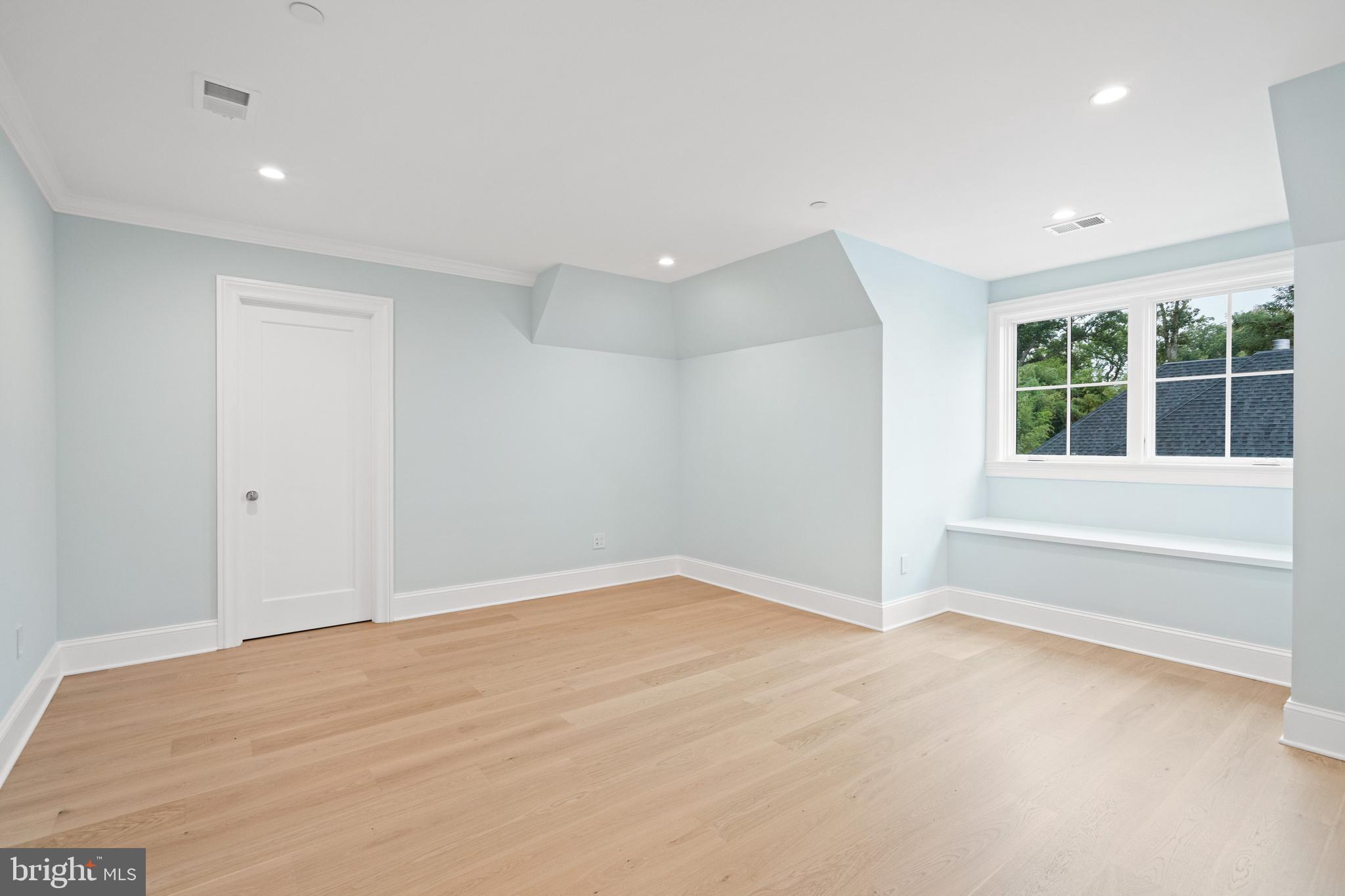2916 Chesapeake Street Northwest Washington, DC 20008 - Photo 38 of 54 wooden floor in an empty room with a window