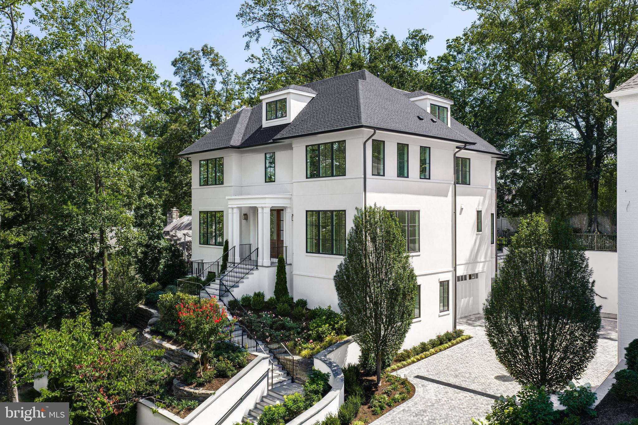 2916 Chesapeake Street Northwest Washington, DC 20008 - Photo 53 of 54 a front view of a house with a garden