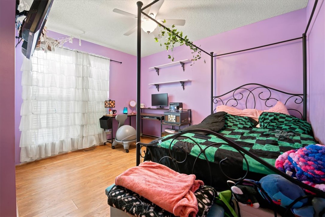 520 Sharon Lane Seneca, SC 29678 - Photo 29 of 48 Hardwood floors and a ceiling fan create a comfortable and inviting atmosphere in this bedroom.