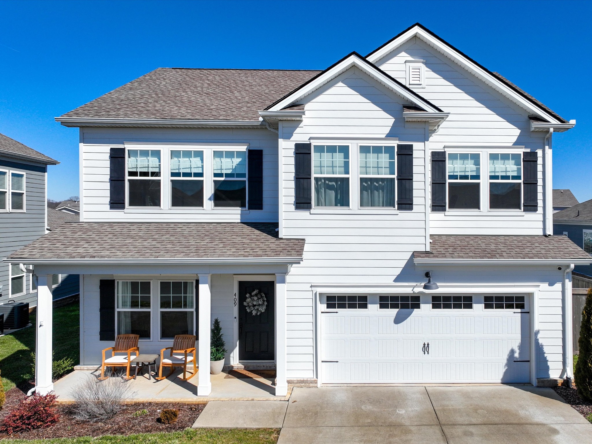 409 Rangeland Road Spring Hill, TN 37174 - Photo 1 of 75 a front view of a house with a yard