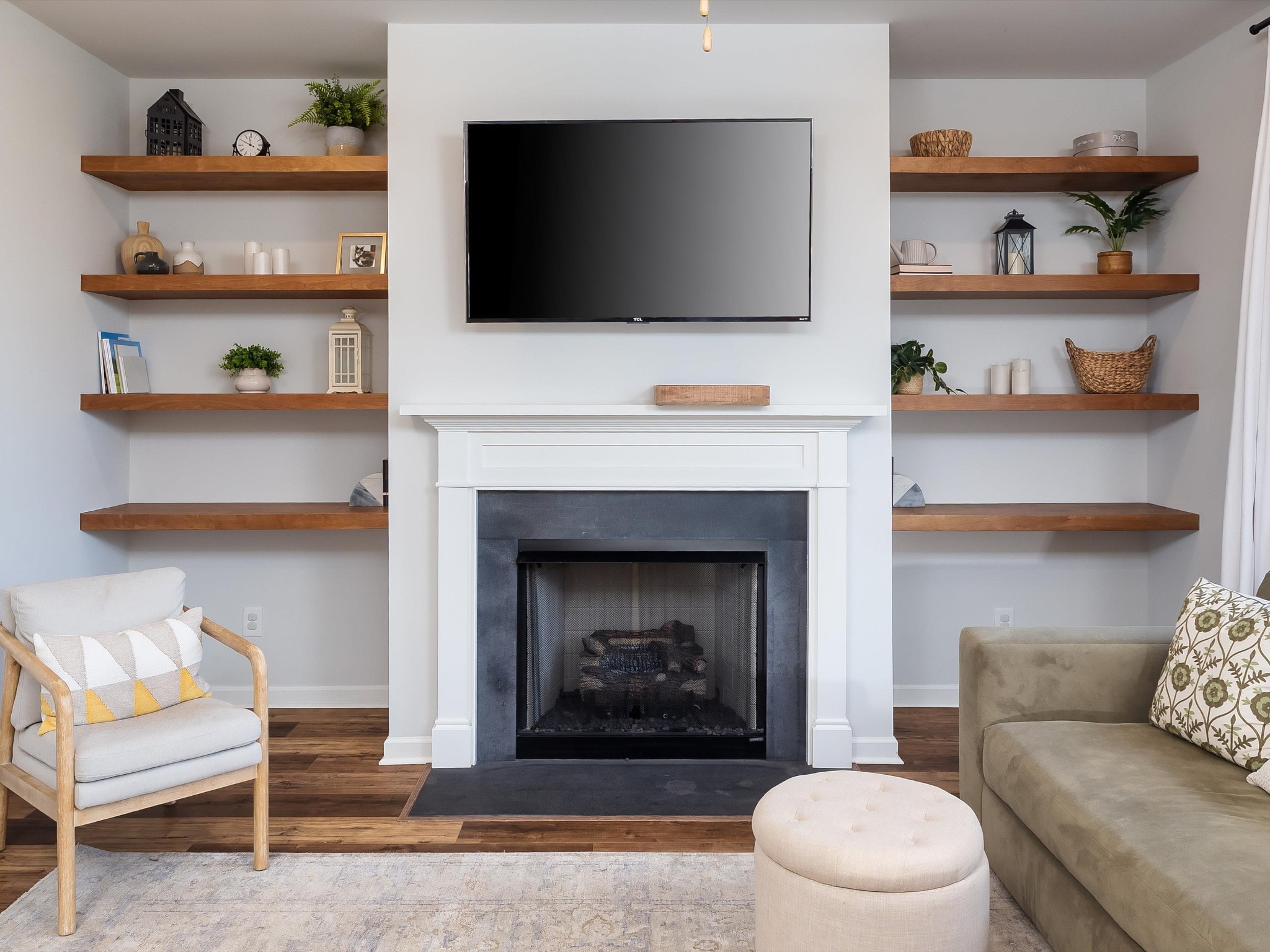 409 Rangeland Road Spring Hill, TN 37174 - Photo 12 of 75 a living room with furniture and a fireplace