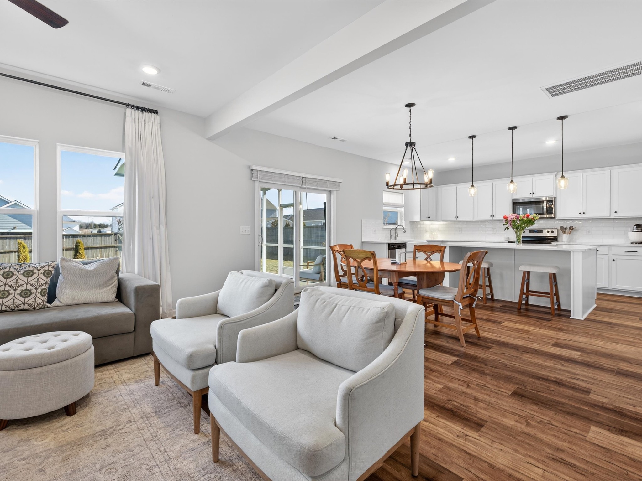 409 Rangeland Road Spring Hill, TN 37174 - Photo 14 of 75 a living room with furniture kitchen view and a wooden floor