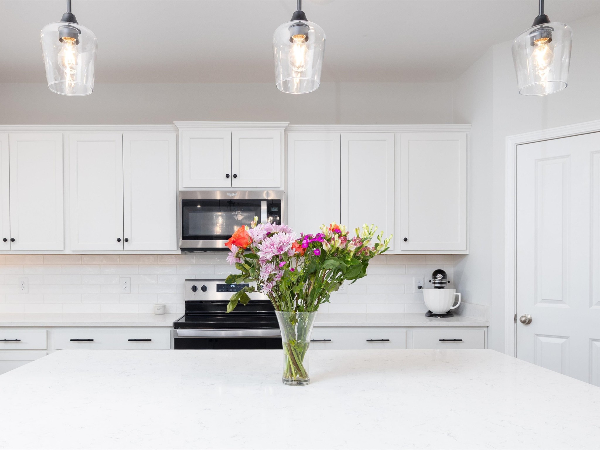 409 Rangeland Road Spring Hill, TN 37174 - Photo 17 of 75 a white kitchen with a sink dishwasher and white cabinets