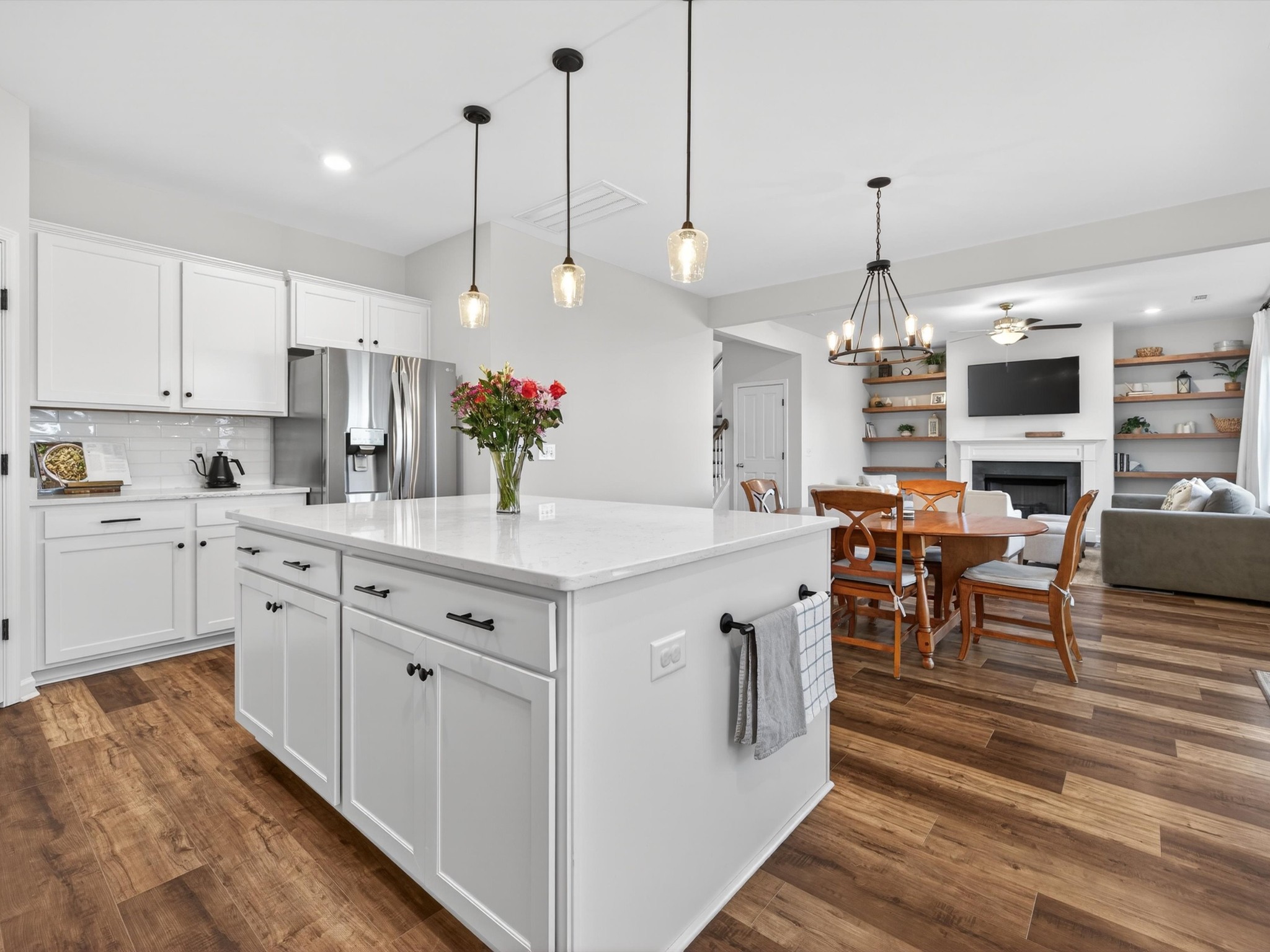 409 Rangeland Road Spring Hill, TN 37174 - Photo 20 of 75 a kitchen with kitchen island granite countertop a sink a center island and cabinets