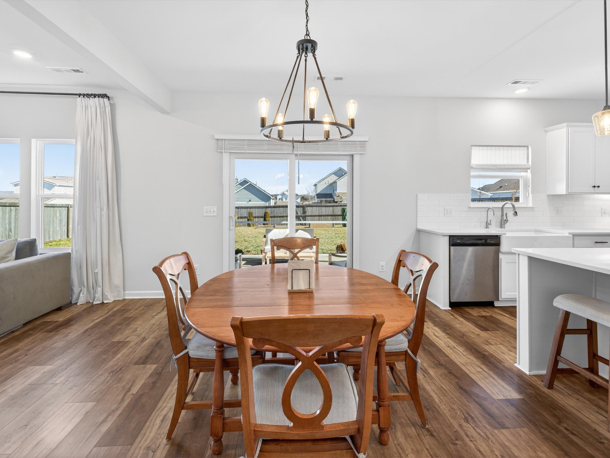 409 Rangeland Road Spring Hill, TN 37174 - Photo 21 of 75 a view of a dining room with furniture window and wooden floor