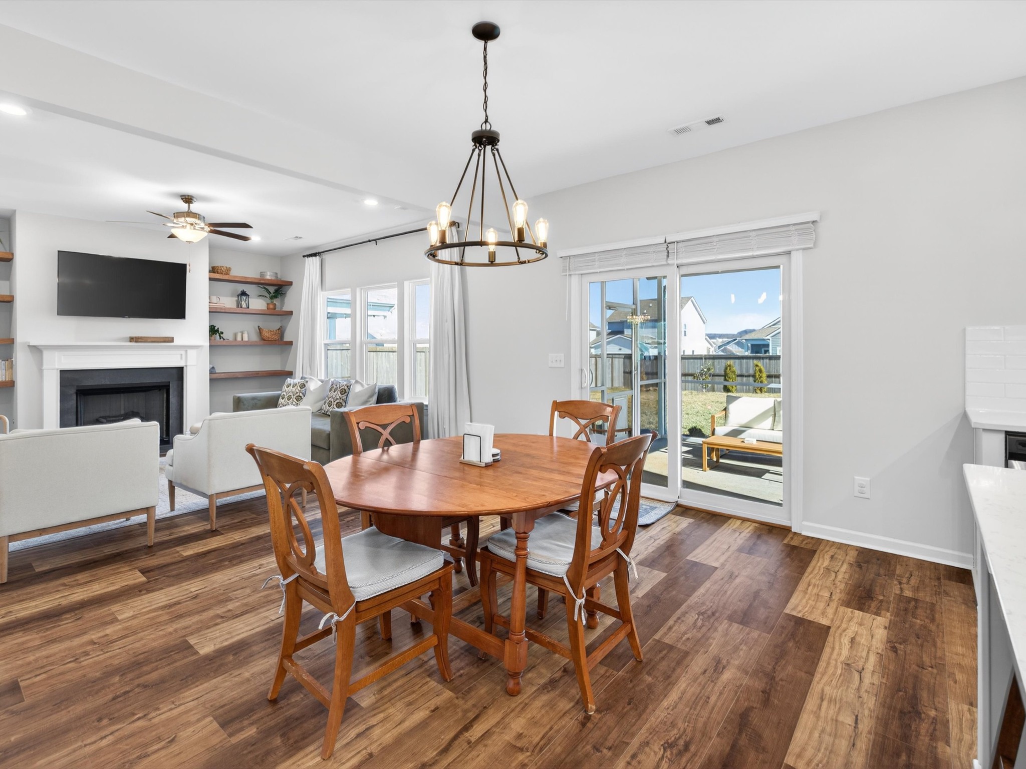 409 Rangeland Road Spring Hill, TN 37174 - Photo 23 of 75 a view of a dining room with furniture window and wooden floor