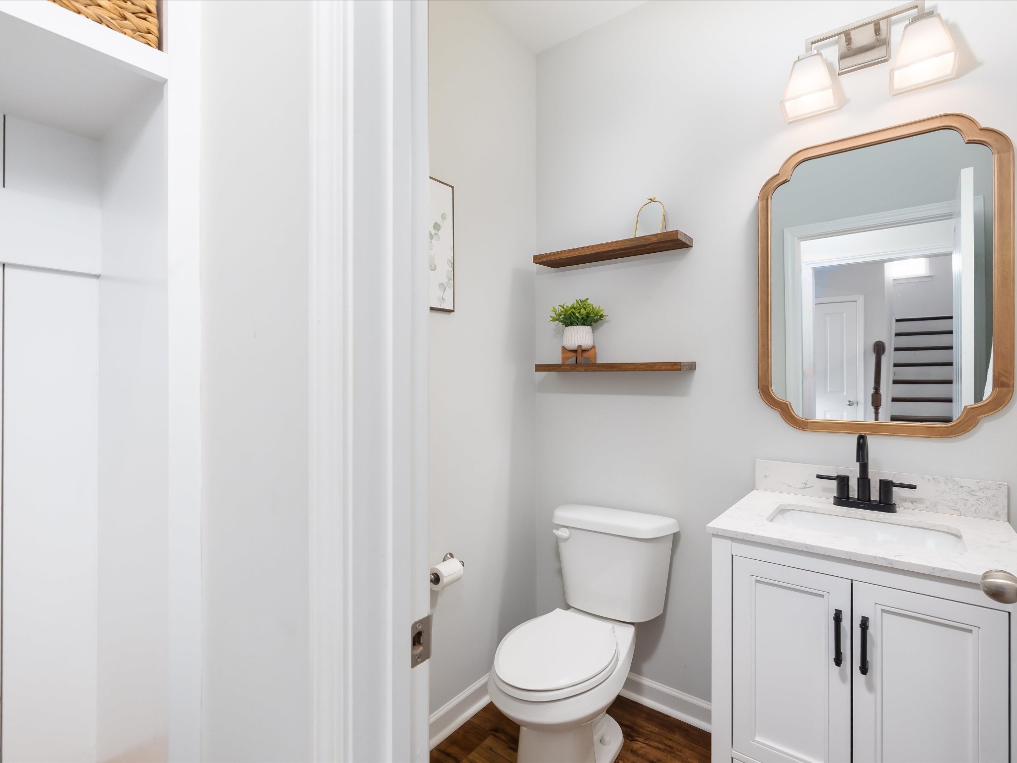 409 Rangeland Road Spring Hill, TN 37174 - Photo 26 of 75 a bathroom with a toilet a sink and mirror