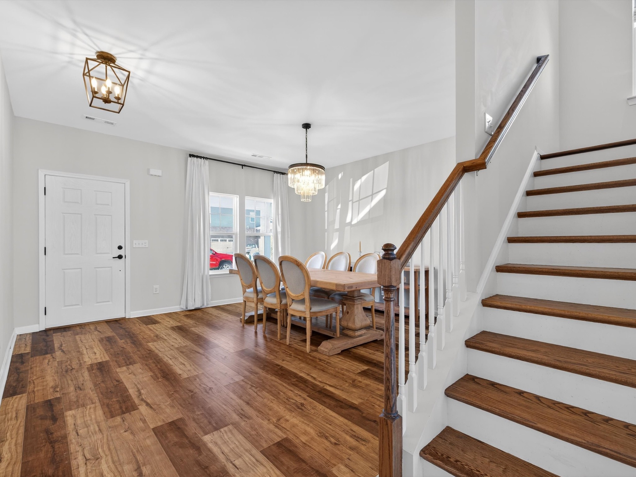 409 Rangeland Road Spring Hill, TN 37174 - Photo 27 of 75 a dining room with wooden floor and white walls