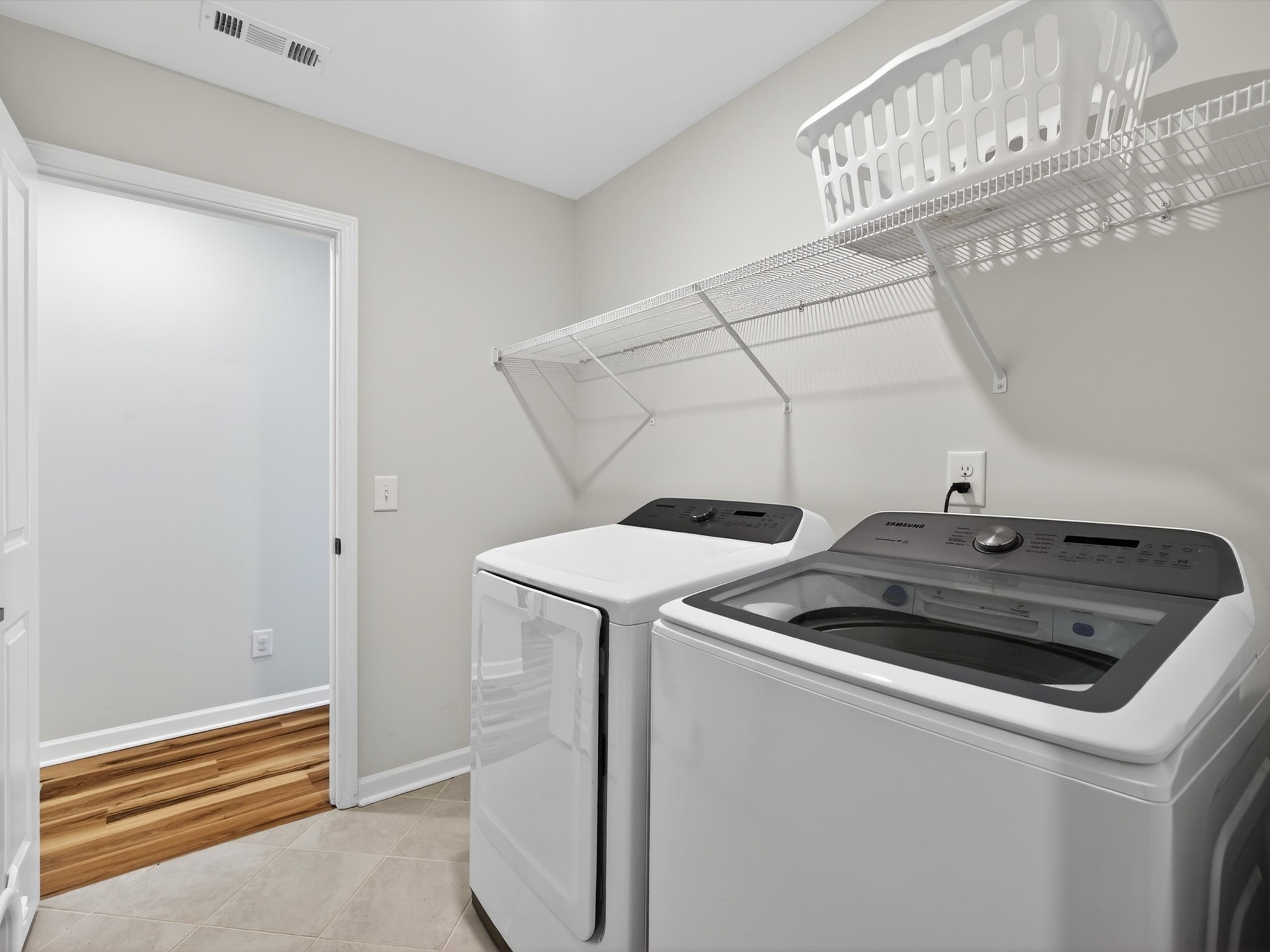 409 Rangeland Road Spring Hill, TN 37174 - Photo 42 of 75 a utility room with dryer and washer