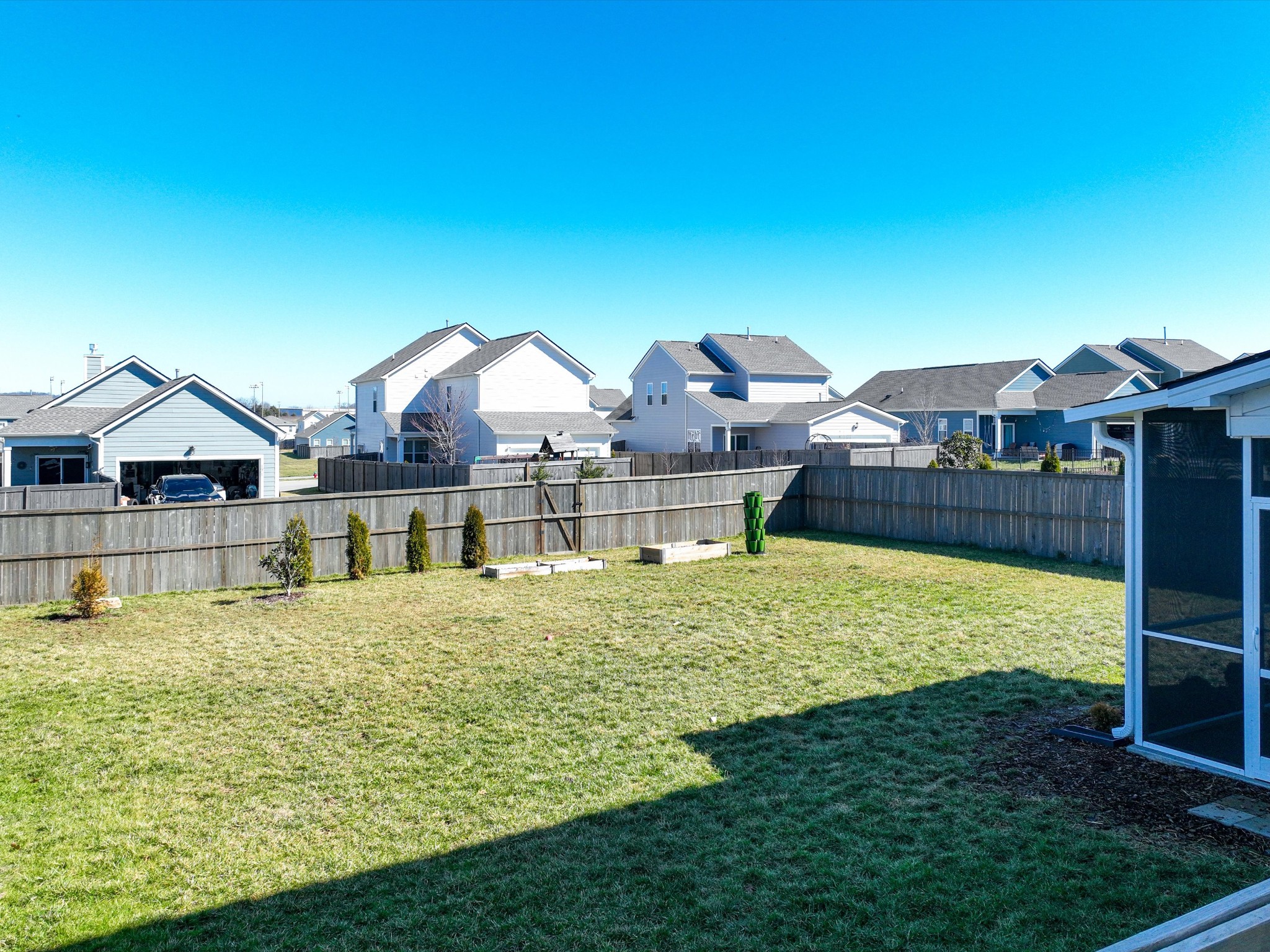 409 Rangeland Road Spring Hill, TN 37174 - Photo 58 of 75 a front view of house with yard and swimming pool