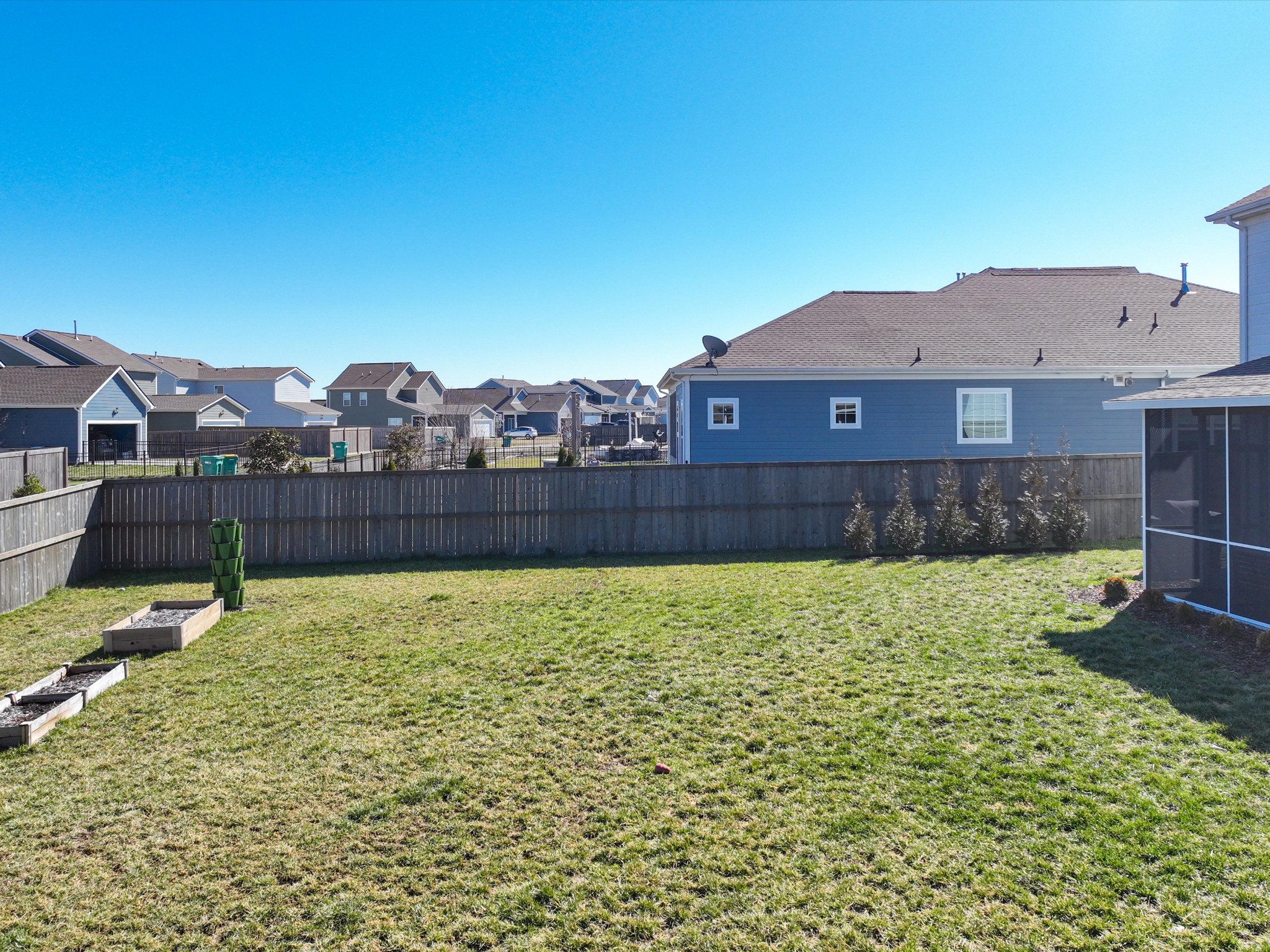 409 Rangeland Road Spring Hill, TN 37174 - Photo 60 of 75 a view of a house with a yard and a large tree