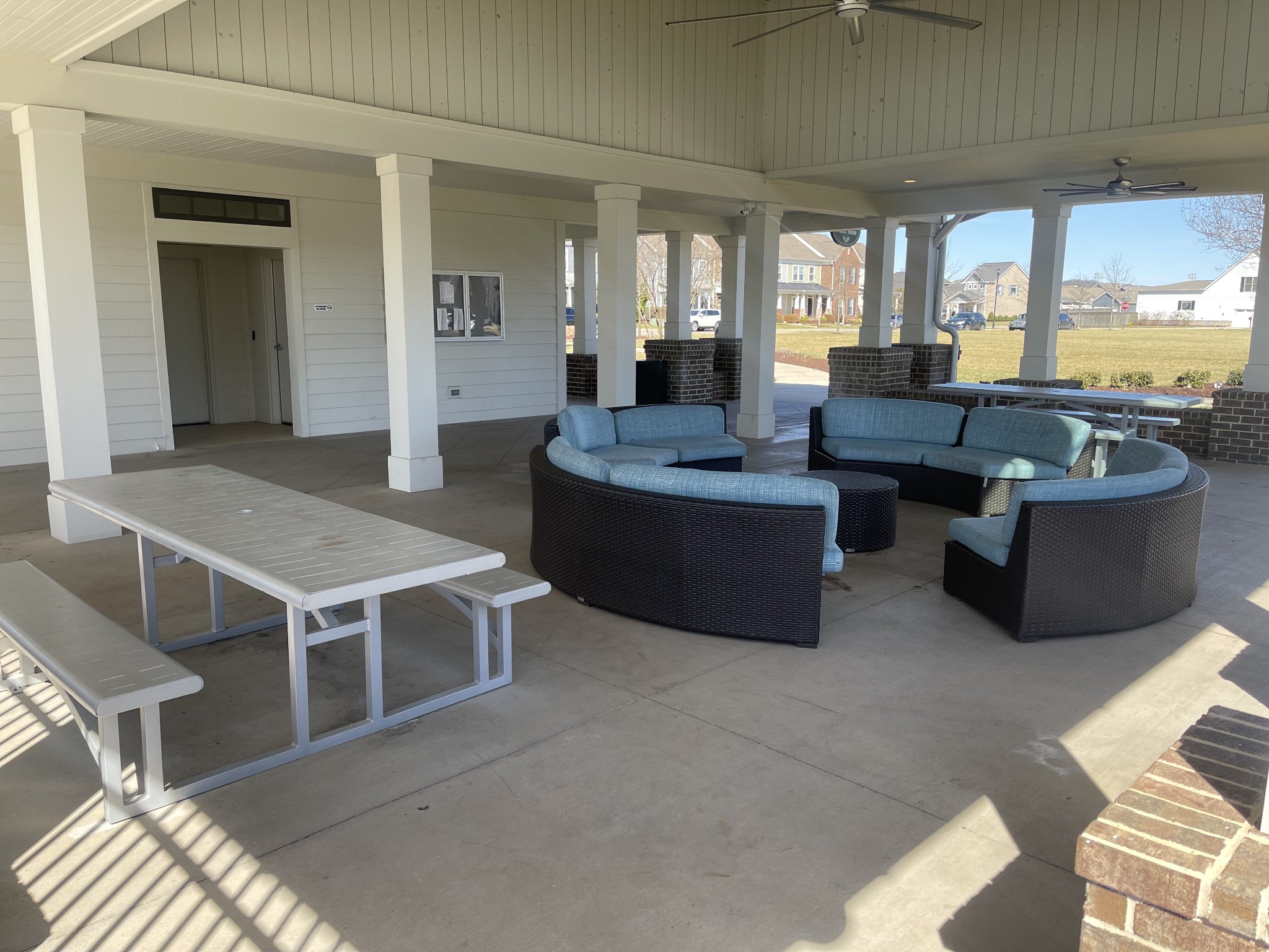 409 Rangeland Road Spring Hill, TN 37174 - Photo 67 of 75 a living room with couches and kitchen view with wooden floor