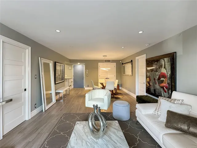 a room with lots of chairs and mirrors