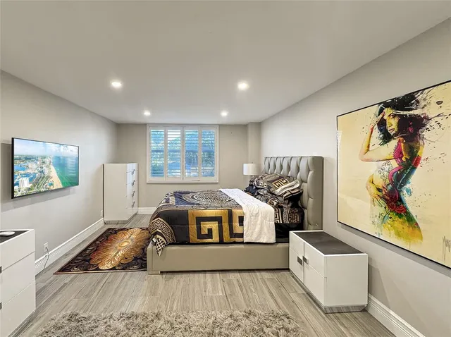 a living room with a bed furniture and a window