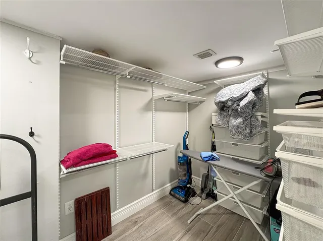 a view of a room with storage and utility room