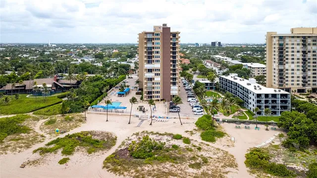 a view of ocean with a multi story building