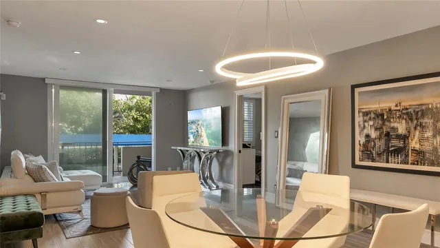 a dining room with furniture and wooden floor