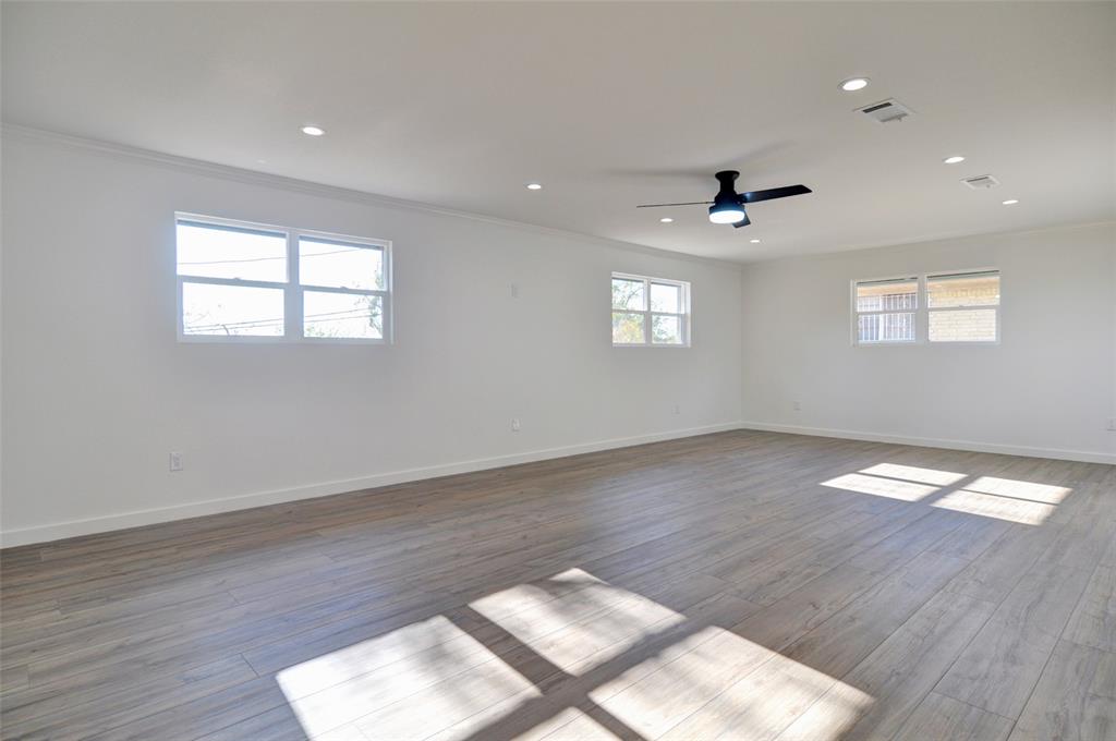 5549 Sam Calloway Road Fort Worth, TX 76114 - Photo 13 of 31 a view of wooden floor and windows in a room