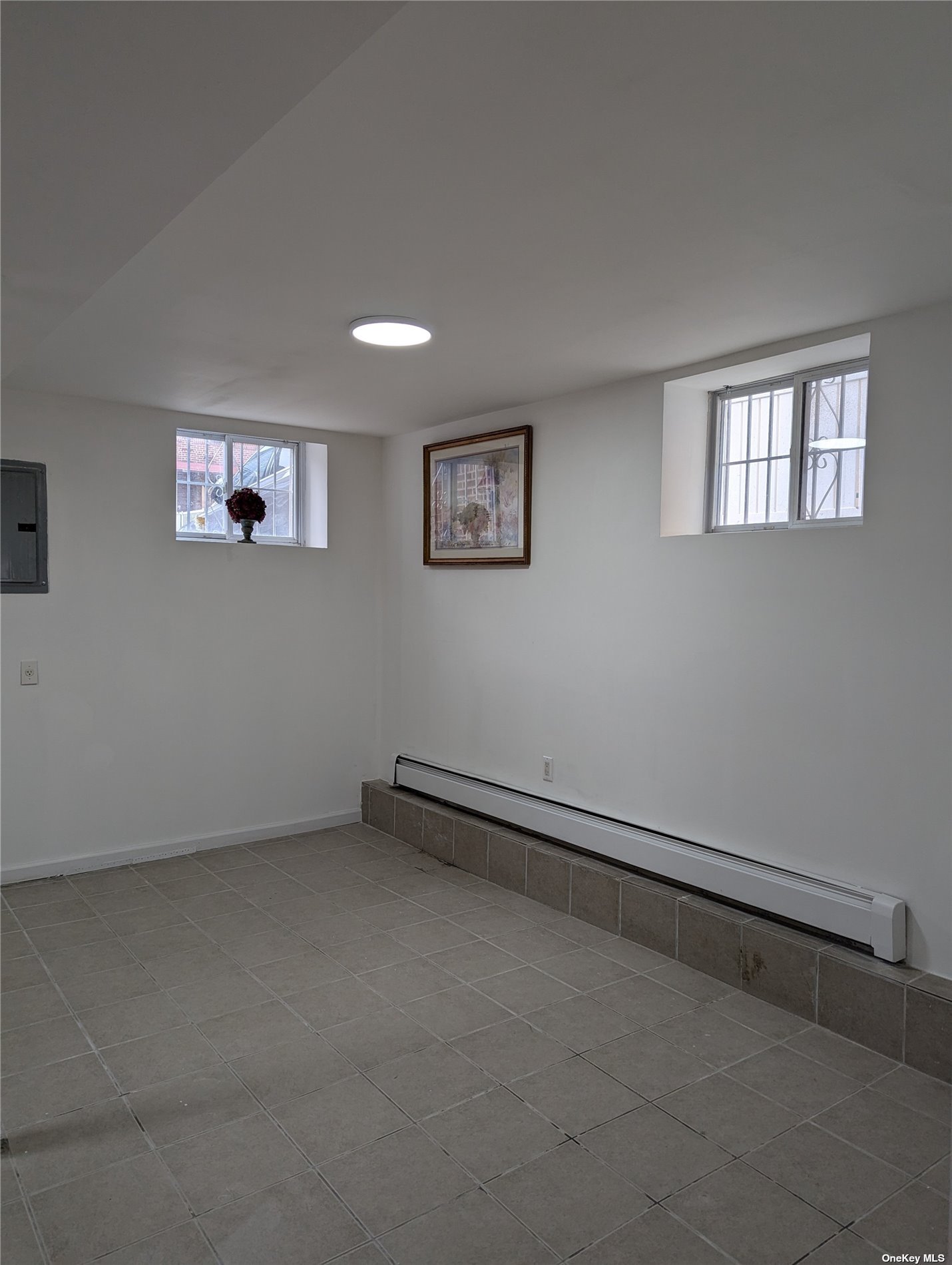 33-17 72nd Street, Unit 1 Queens, NY 11372 - Photo 2 of 7 a view of an empty room with a window