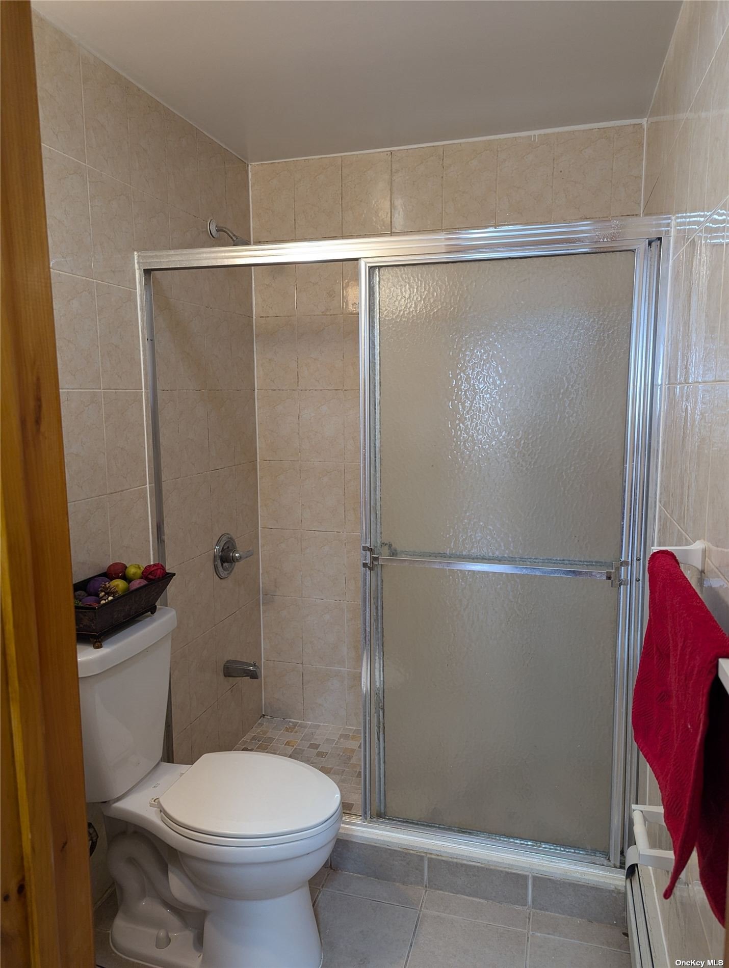 33-17 72nd Street, Unit 1 Queens, NY 11372 - Photo 4 of 7 a bathroom with a toilet and a shower