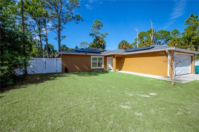 a view of a house with a garden