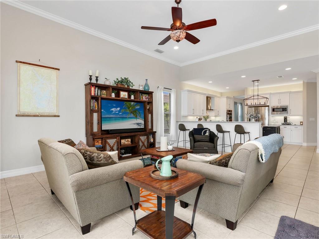 2756 Crystal Way Naples, FL 34119 - Photo 26 of 50 a living room with furniture kitchen view and a table