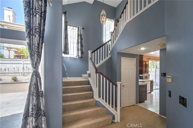 a view of an entryway with wooden floor and windows