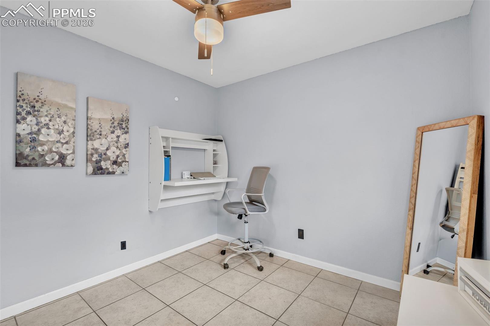 1498 Peterson Road Colorado Springs, CO 80915 - Photo 31 of 44 Unfurnished office with ceiling fan and tile patterned floors