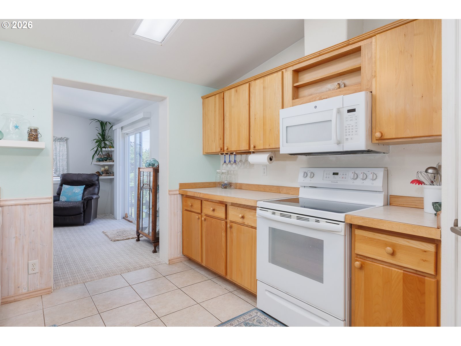 2018 Northwest Oceanic Loop Waldport, OR 97394 - Photo 10 of 35 a kitchen with a stove a sink and a refrigerator