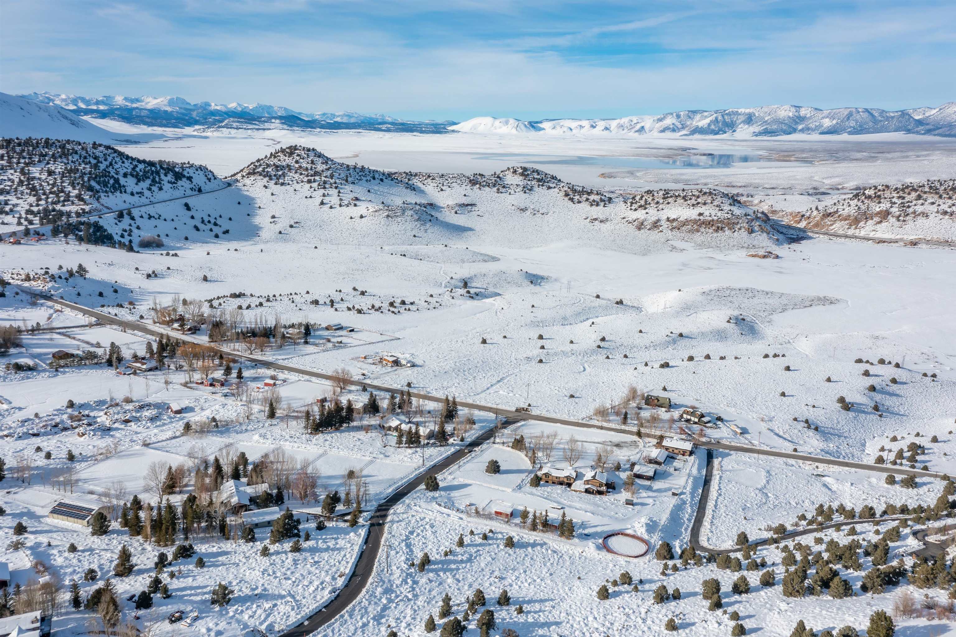 Snowy aerial view featuring a mountain view