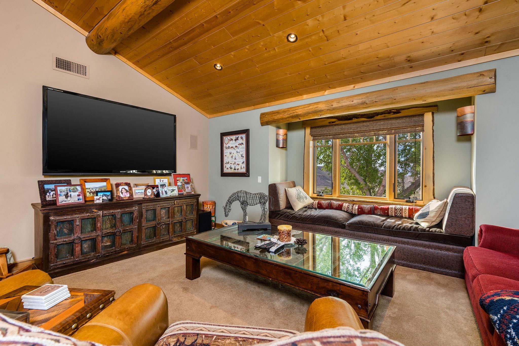 716 Aspen Spring Ranch Road Mammoth Lakes, CA 93546 - Photo 32 of 58 a living room with furniture and a flat screen tv