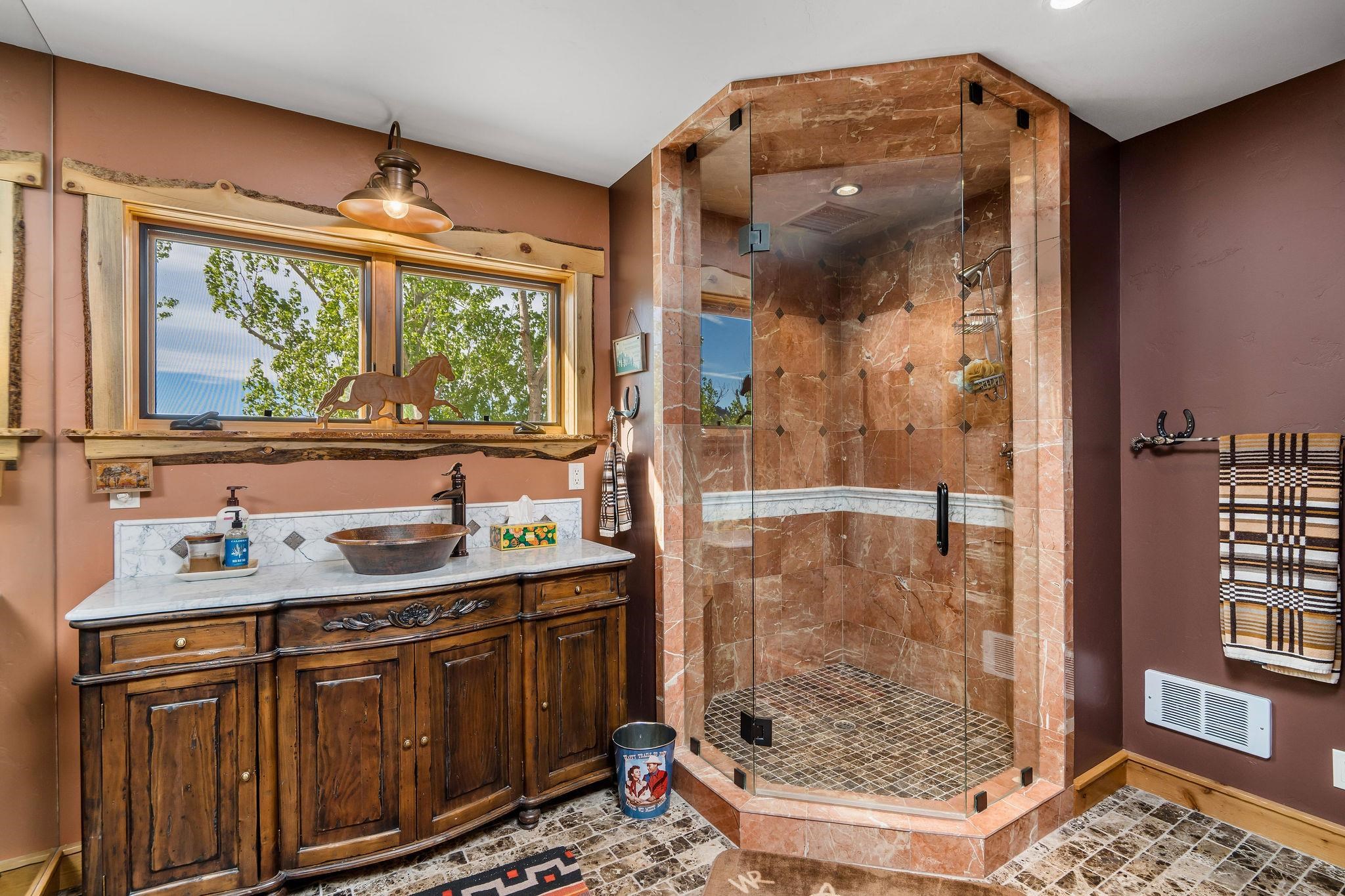 716 Aspen Springs Ranch Road, Unit 59012 Mammoth Lakes, CA 93546 - Photo 35 of 50 a bathroom with a sink mirror and shower