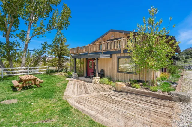 a view of a patio with a yard