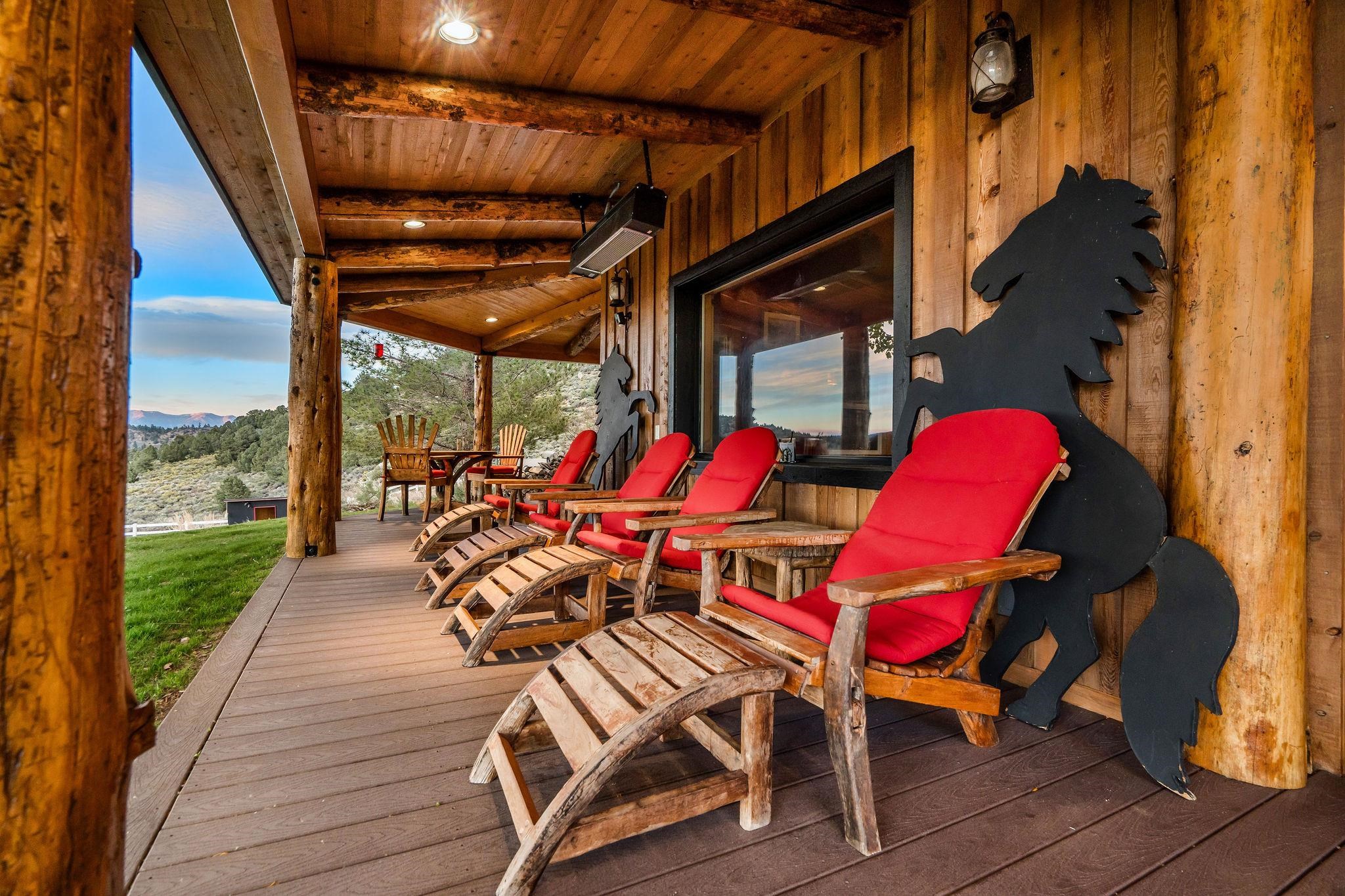 716 Aspen Spring Ranch Road Mammoth Lakes, CA 93546 - Photo 10 of 58 a view of a patio with table and chairs with wooden floor and fence