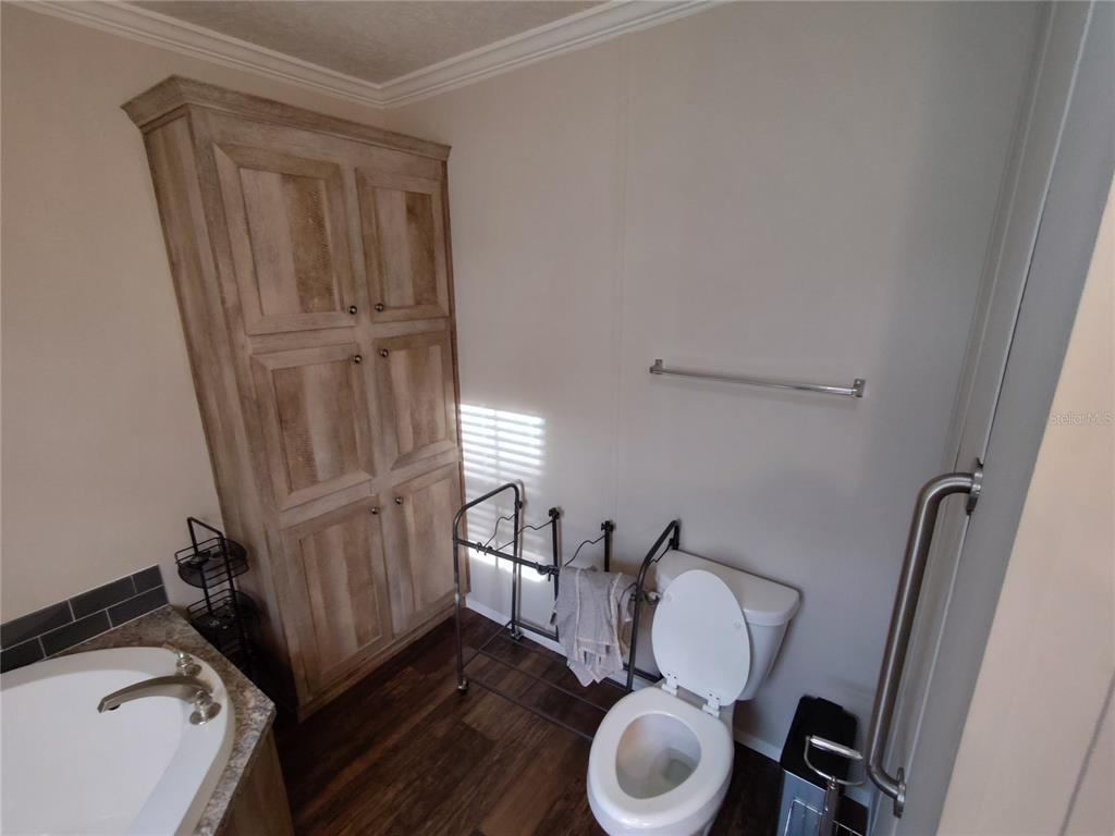 9811 Bud Street Hudson, FL 34669 - Photo 12 of 53 a bathroom with a sink and a mirror