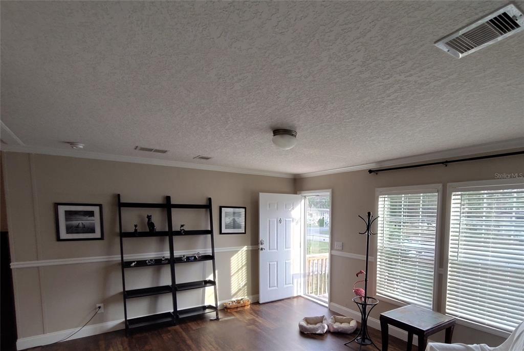 9811 Bud Street Hudson, FL 34669 - Photo 16 of 53 a view of a livingroom with furniture and window
