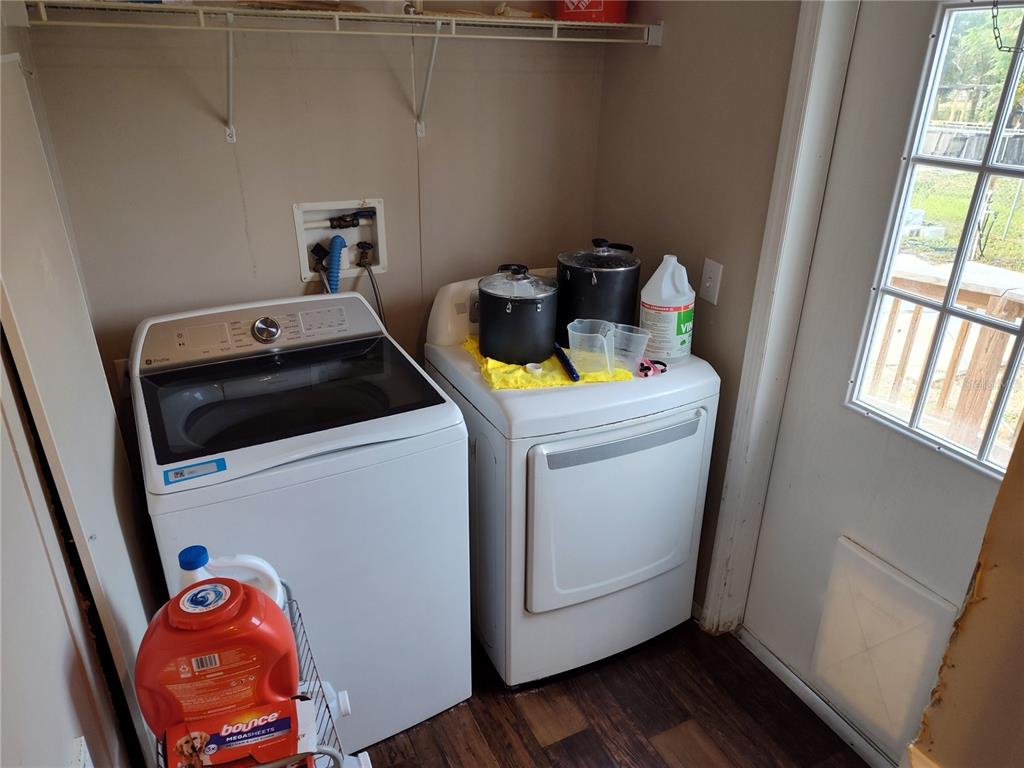 9811 Bud Street Hudson, FL 34669 - Photo 20 of 53 a utility room with dryer and washer