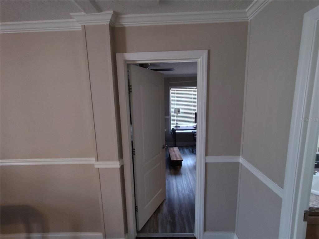 9811 Bud Street Hudson, FL 34669 - Photo 29 of 53 a view of a hallway with a room