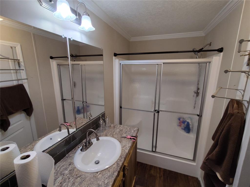9811 Bud Street Hudson, FL 34669 - Photo 32 of 53 a bathroom with a sink toilet and shower