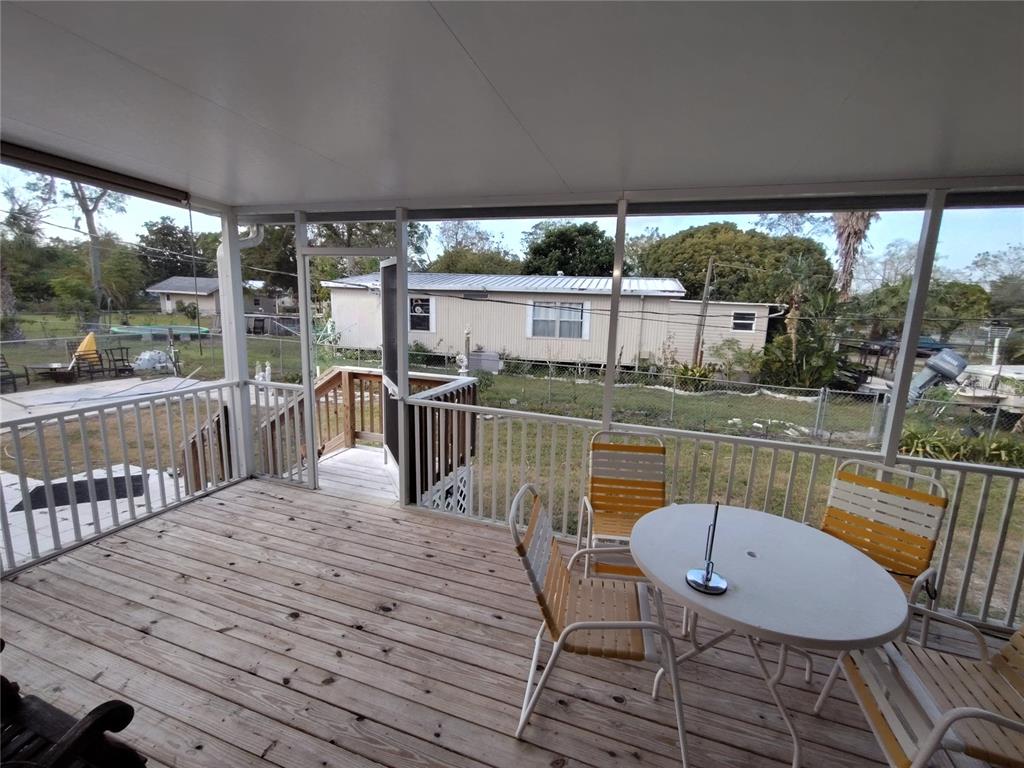 9811 Bud Street Hudson, FL 34669 - Photo 38 of 53 a view of a chairs and table in the roof deck