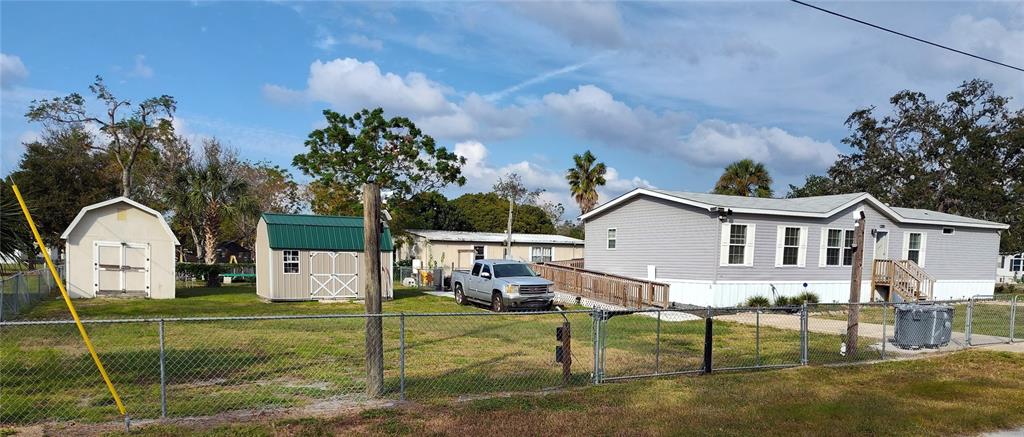 9811 Bud Street Hudson, FL 34669 - Photo 41 of 53 a house view with a garden space