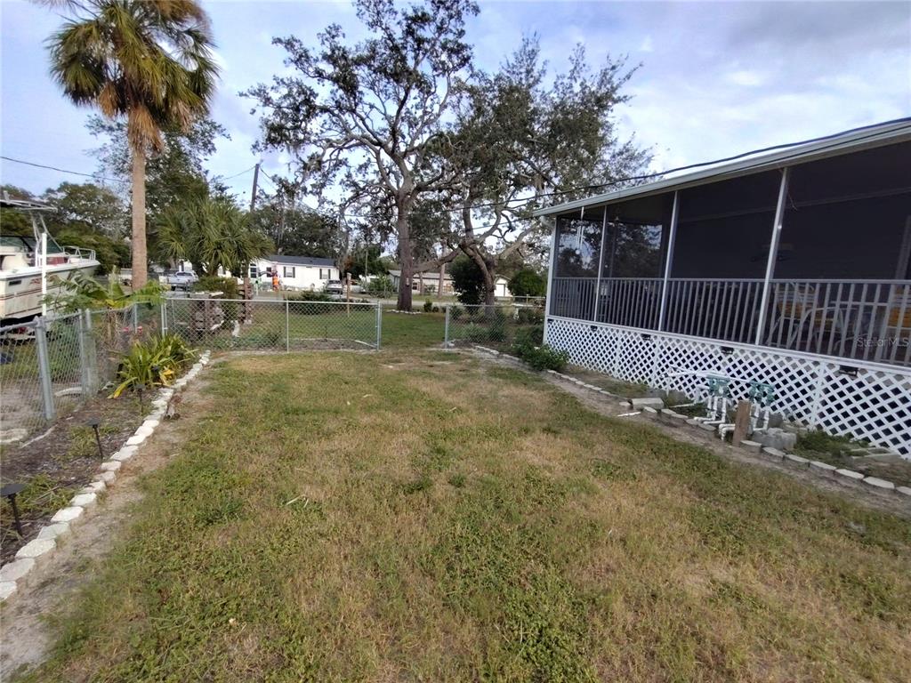 9811 Bud Street Hudson, FL 34669 - Photo 45 of 53 a backyard of a house with lots of green space